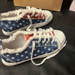 Red, white and blue tennis shoes